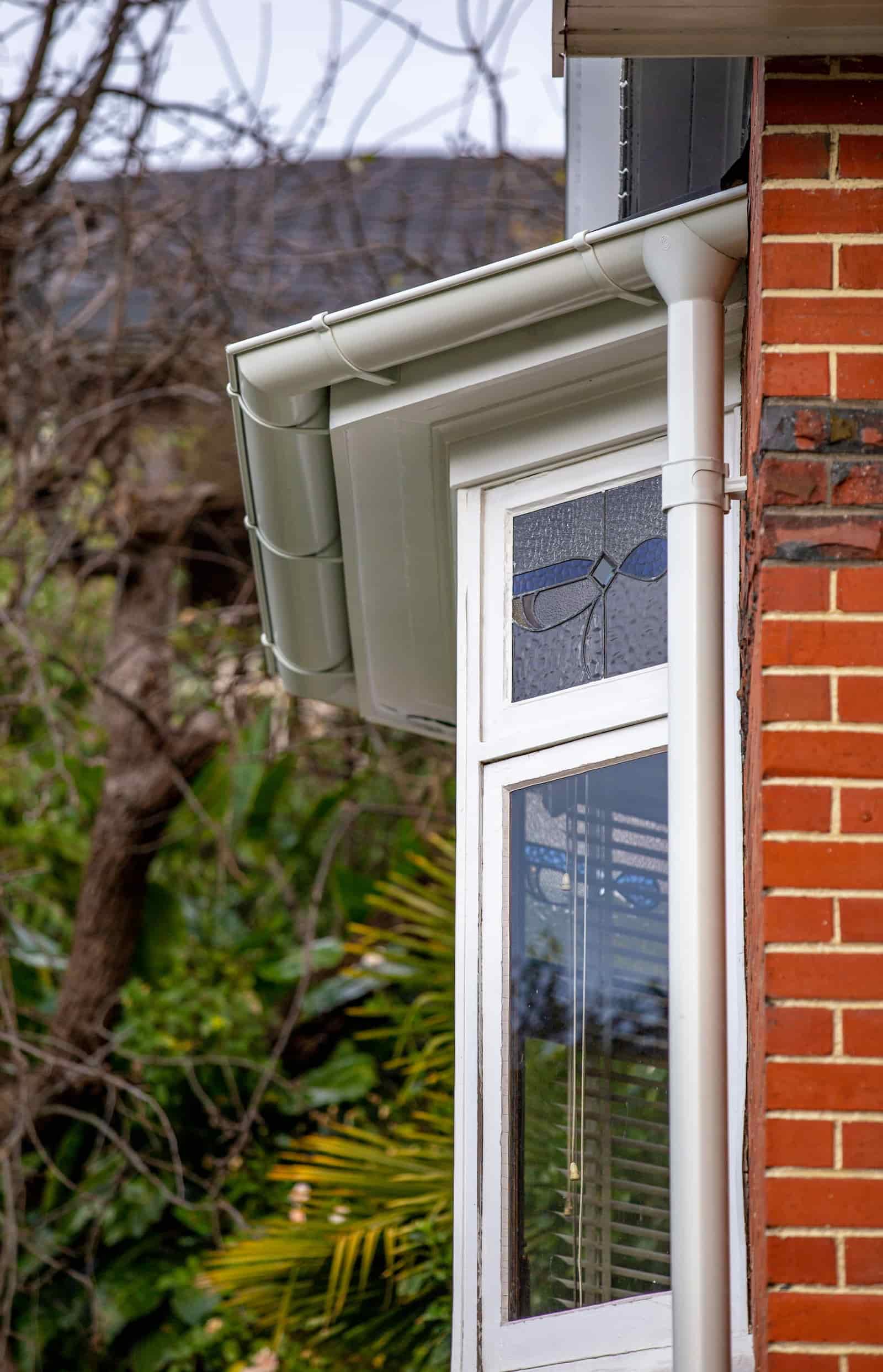 A close-up of installed guttering and fascia detailing on a residential project.