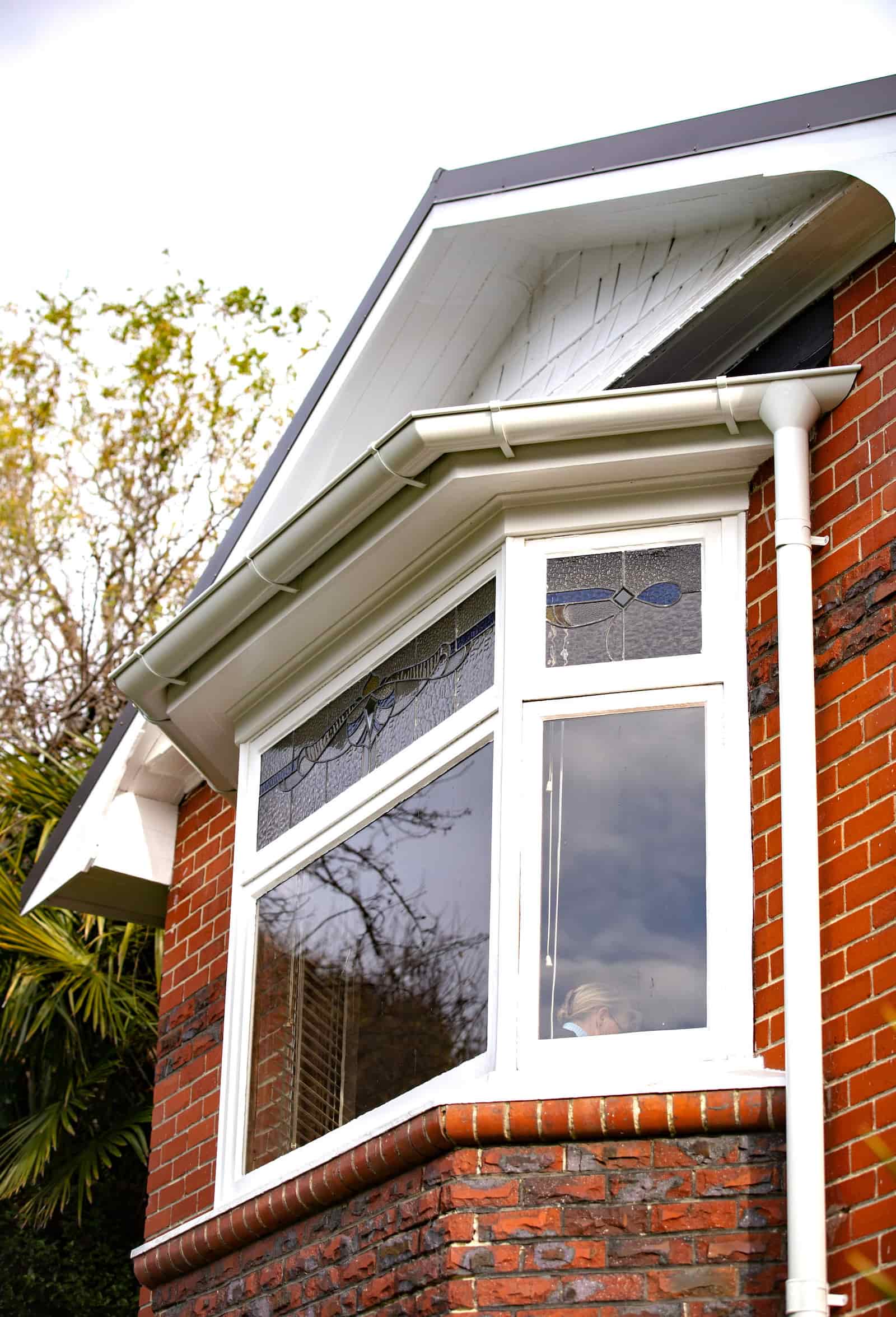 A roof drainage installation detail featuring Lindab guttering.