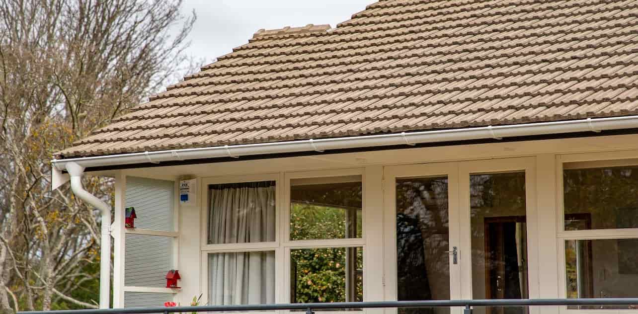 A house with a roof and a balcony, providing a cozy and elevated space for relaxation and outdoor activities.