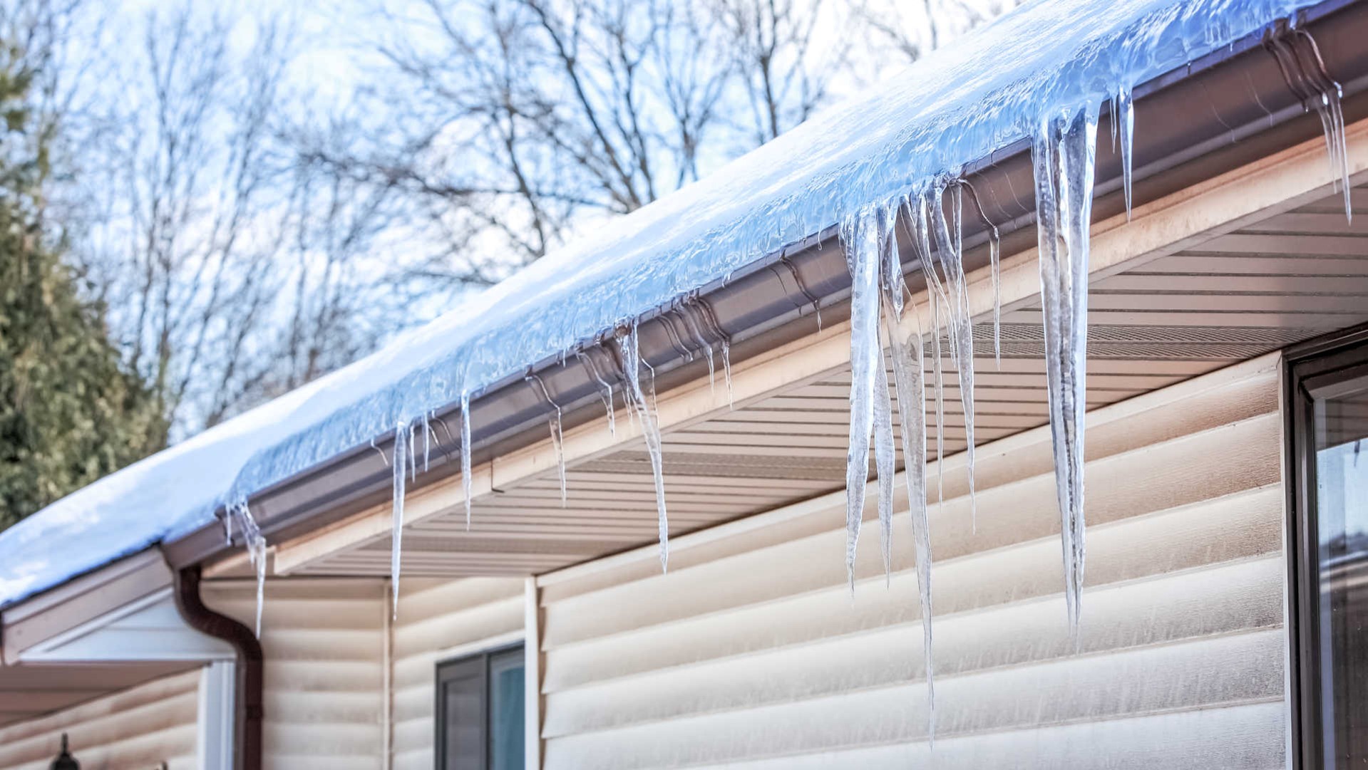 Icicles hanging from frozen gutters