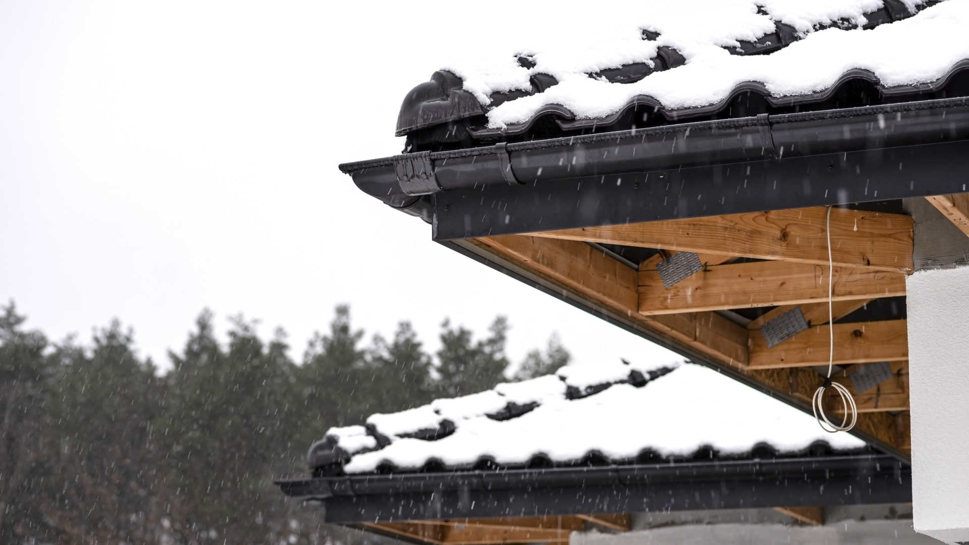 What is a half-round gutter - Half-round gutters on snowy roof